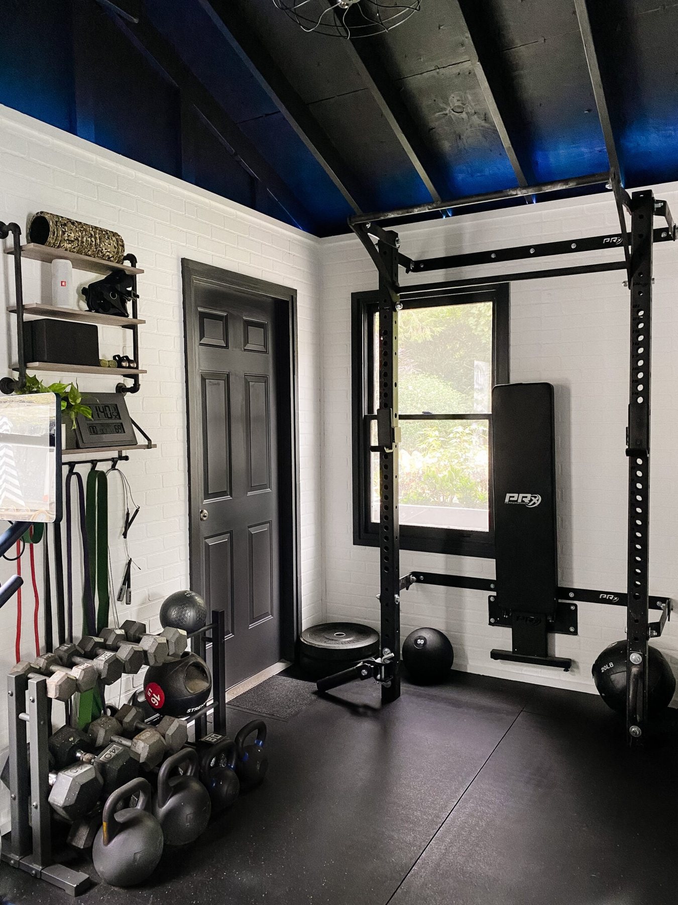 home gym with led lights and weight lifting area