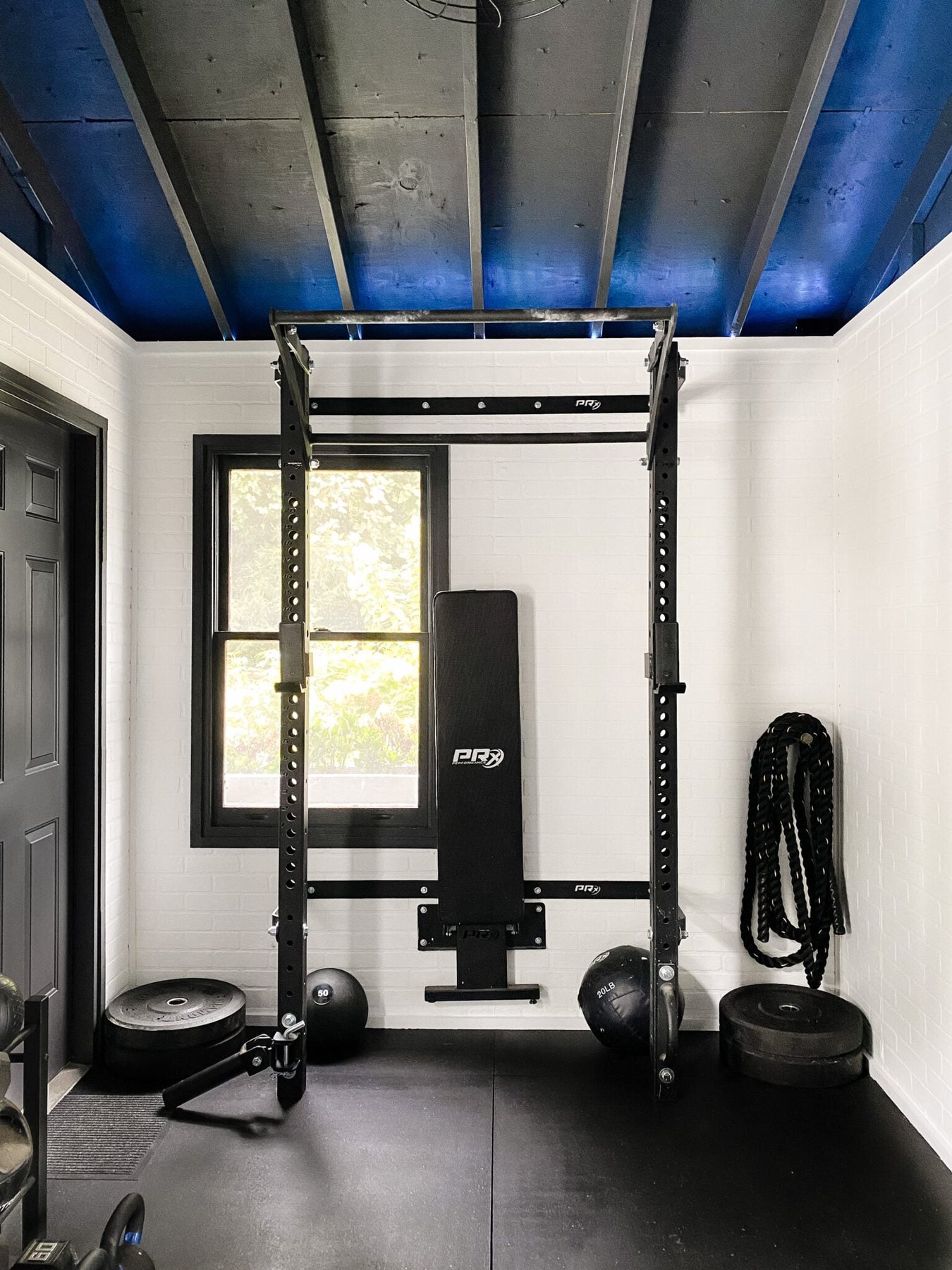 workout shed with squat rack and weight lifting bench
