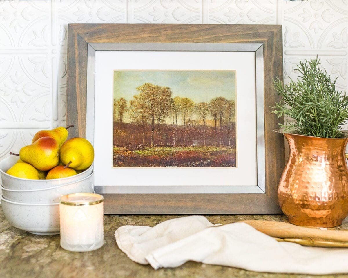 Access to a free autumn landscape art printable that you can print directly from your home printer and frame for budget-friendly fall decor.