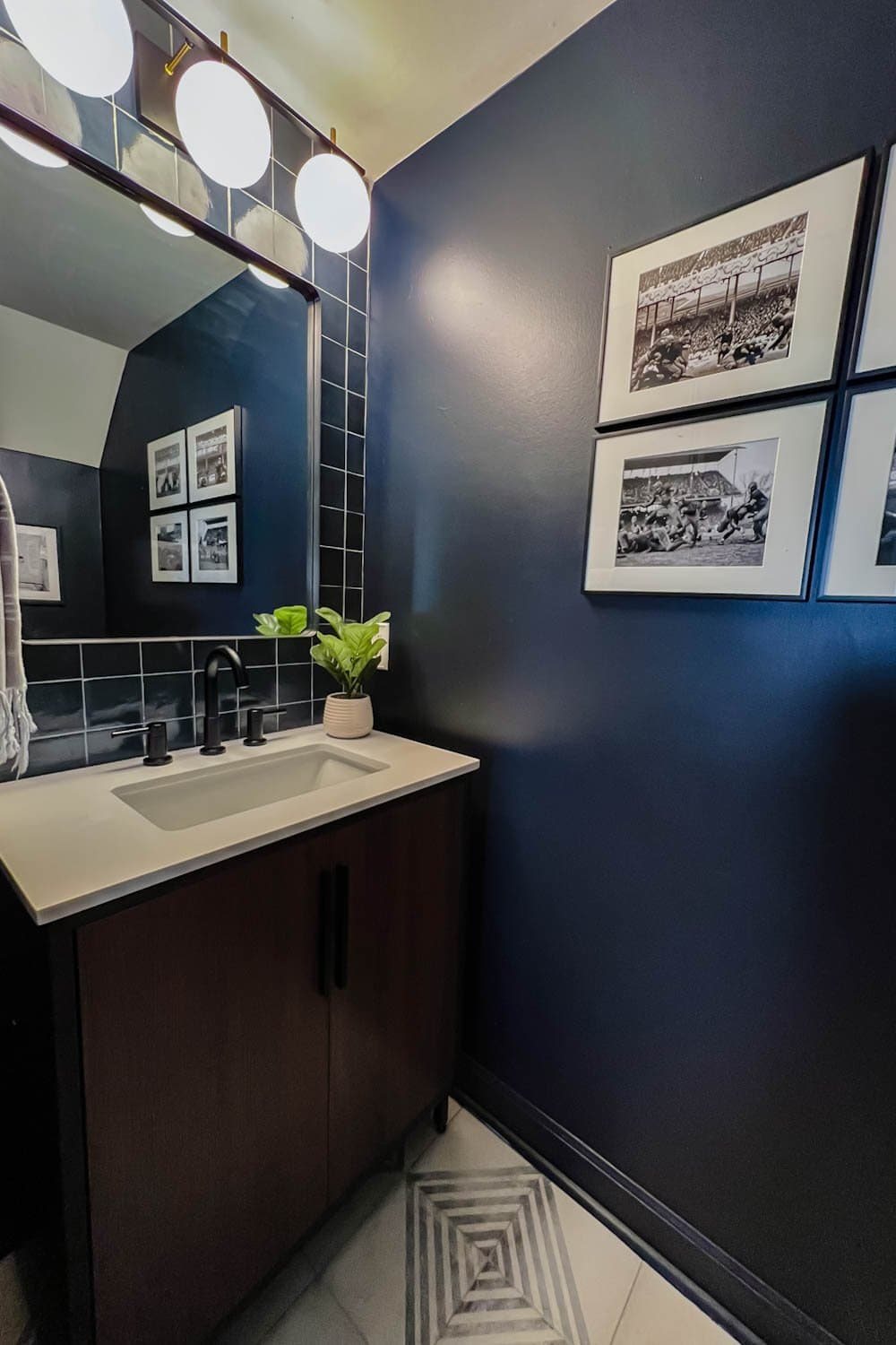 vintage football art prints in a masculine bachelor pad powder room
