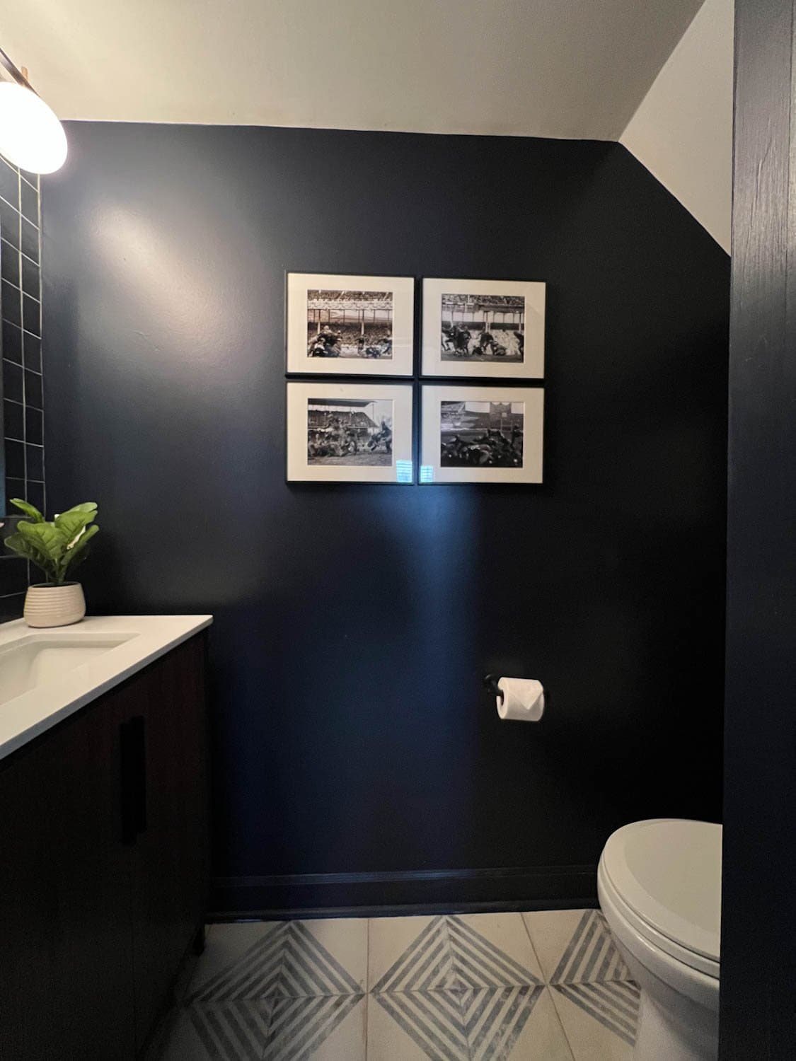navy blue modern powder room with patterned tile floor