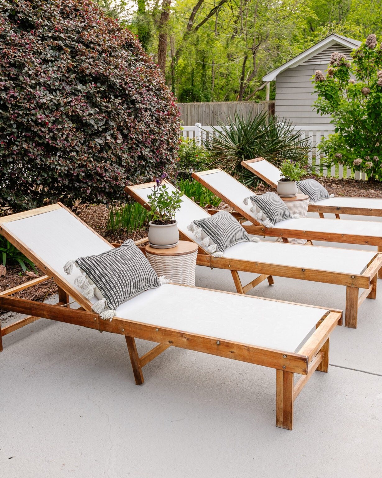 pool sun lounger chairs after spring cleaning with a pressure washer and teak oil