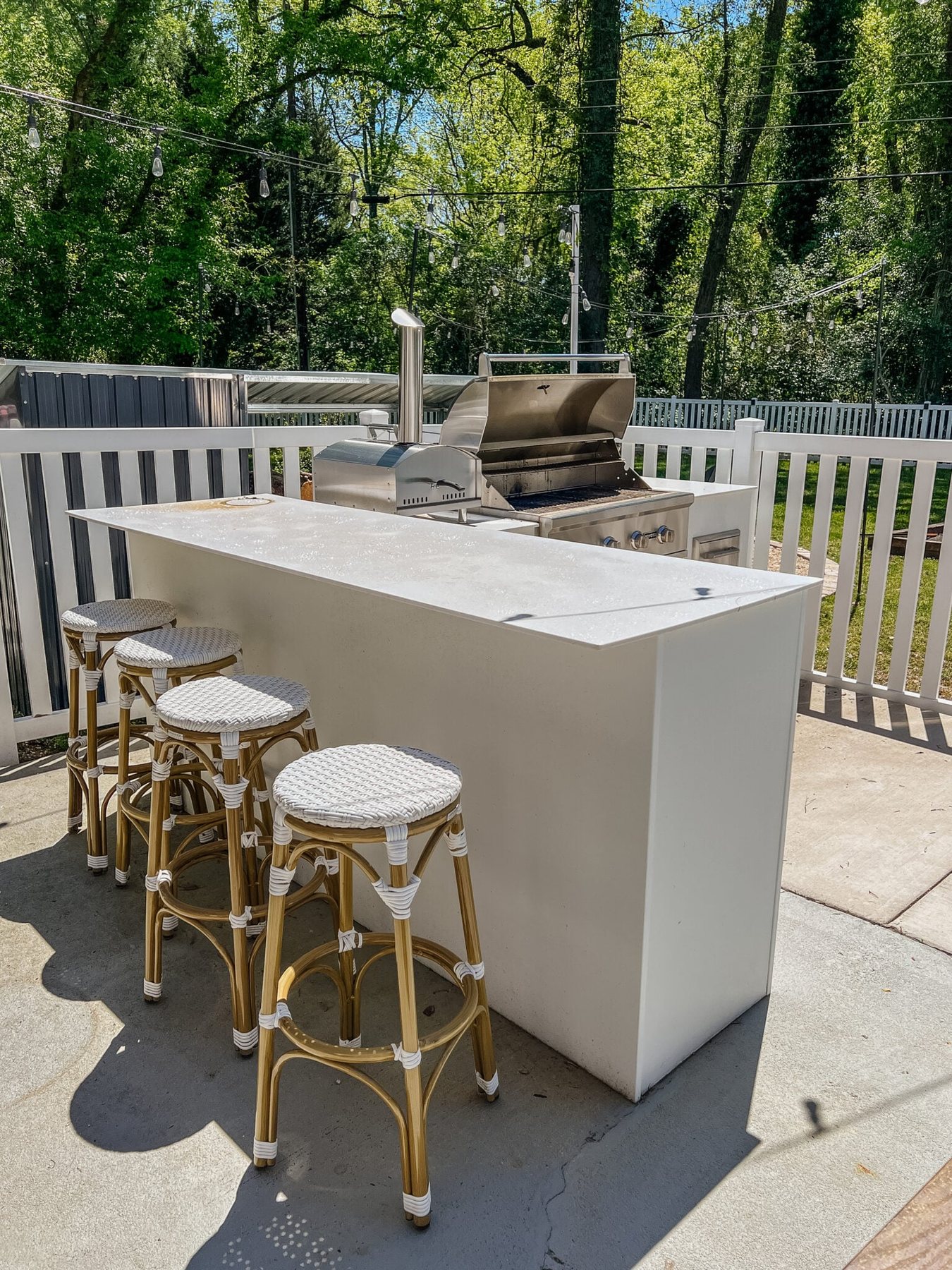 dirty outdoor kitchen with grill before spring cleaning