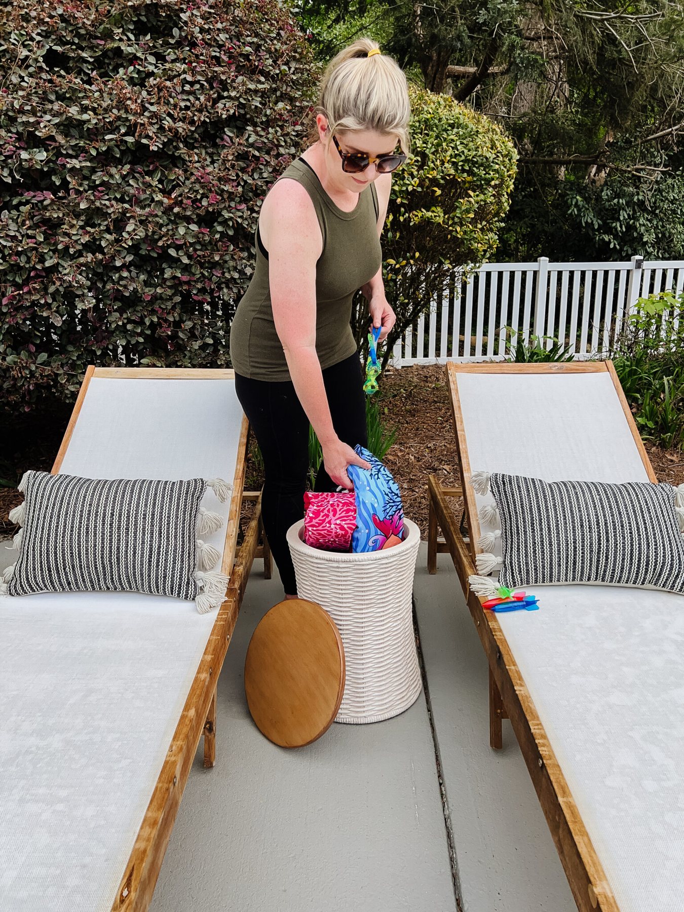 using a garden stool as pool toy storage
