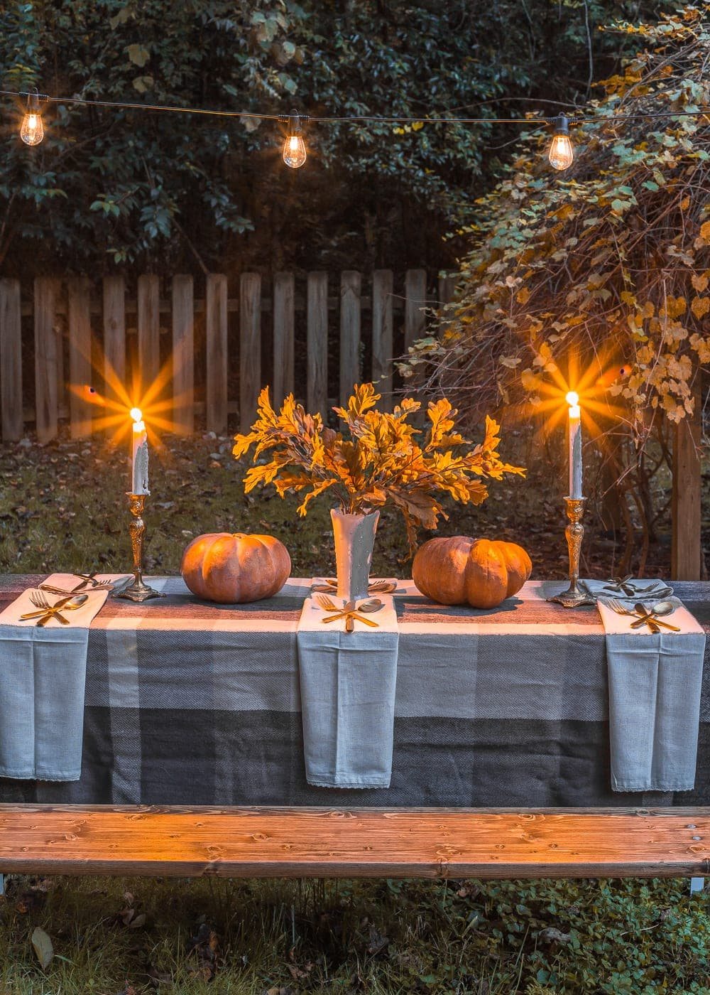 Outdoor Thanksgiving beer garden table with string lights