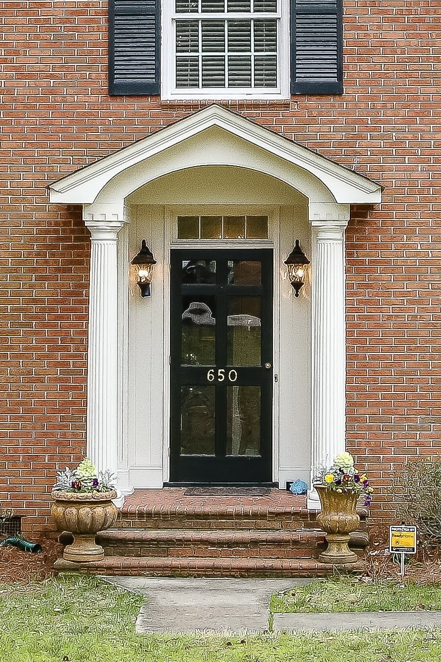 brick colonial house before