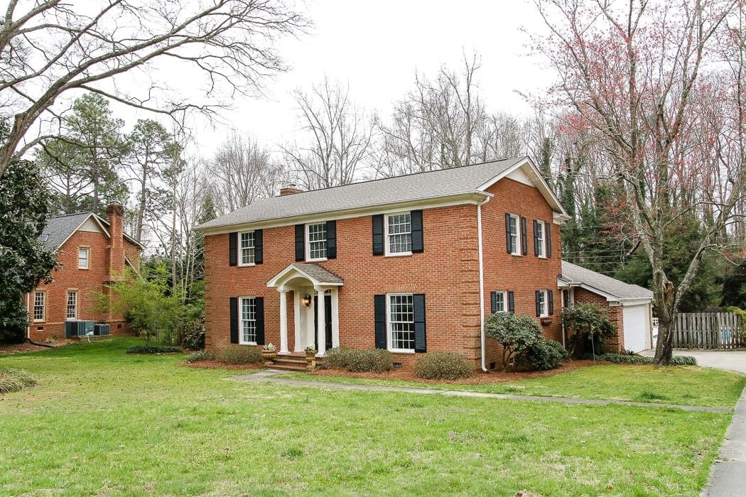 red brick colonial house before