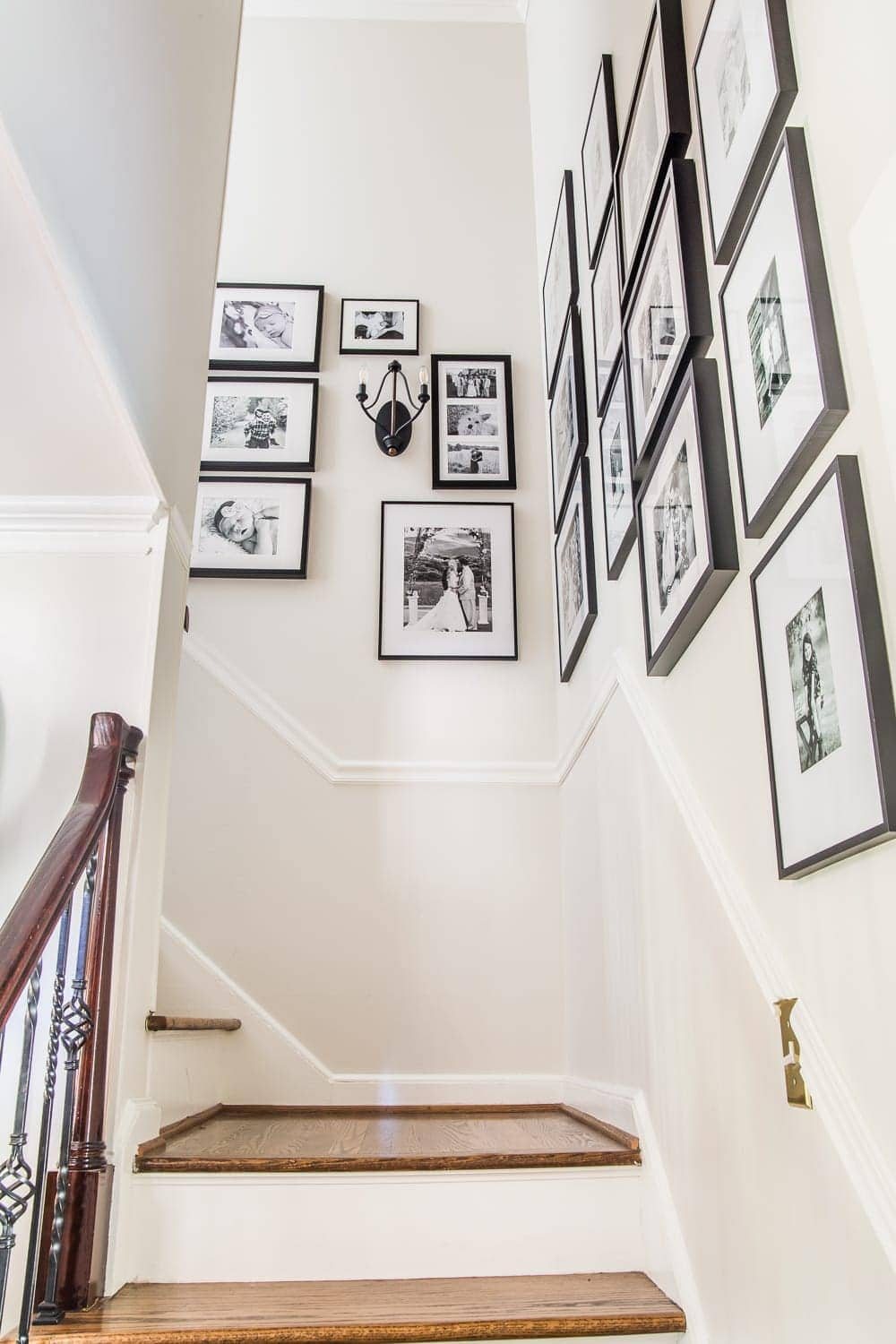 black and white family gallery wall on stairs