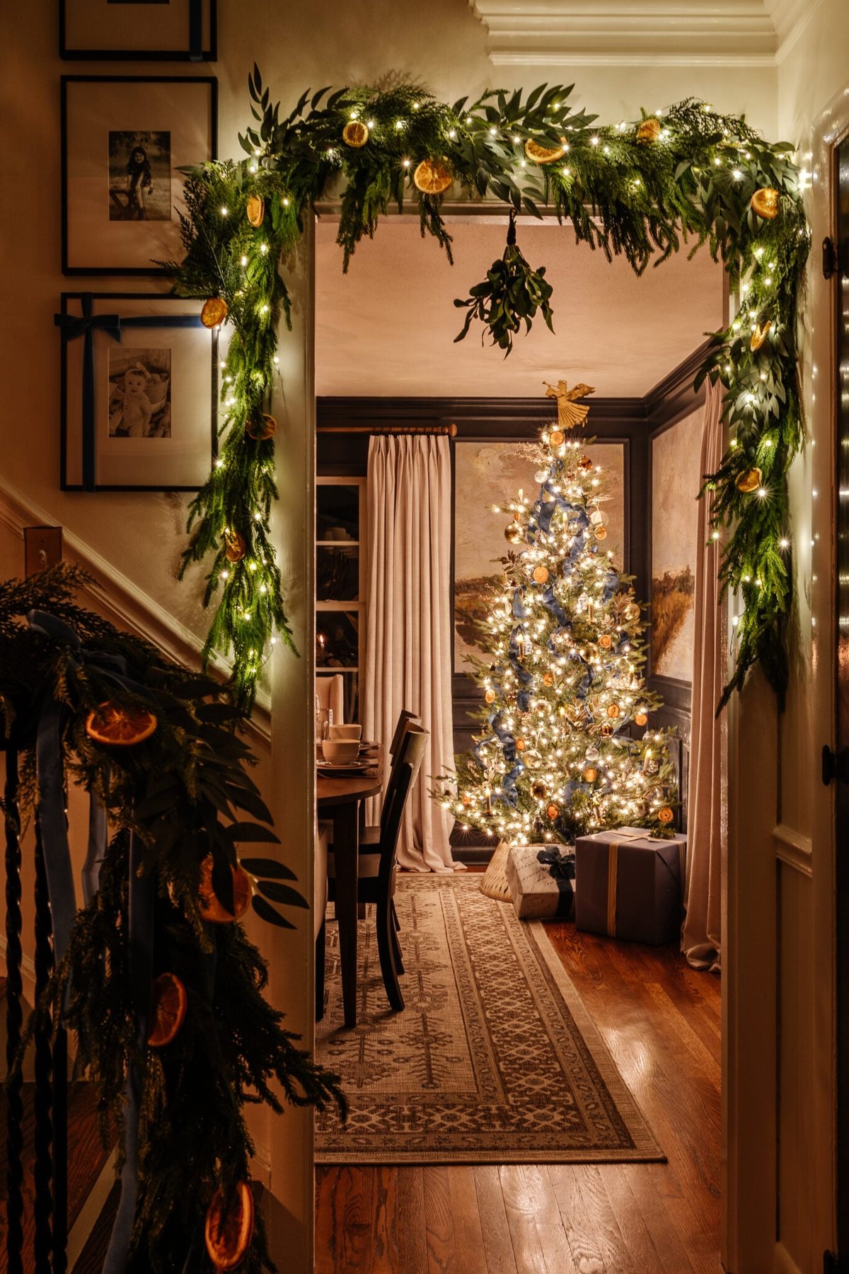 Christmas garland around doorway mixed with battery operated fairy lights