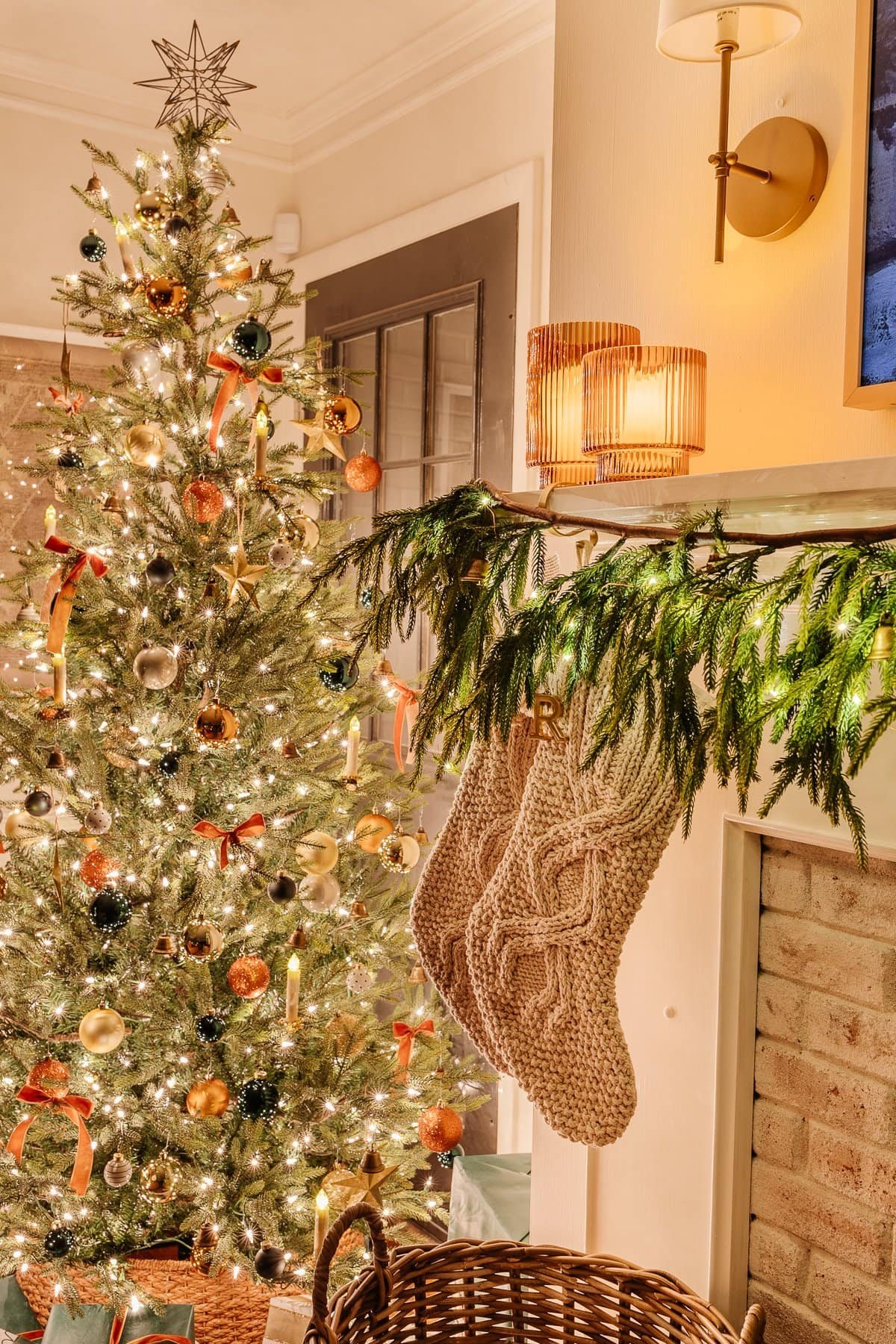 battery operated twinkle lights and candles in a mantel and Christmas tree