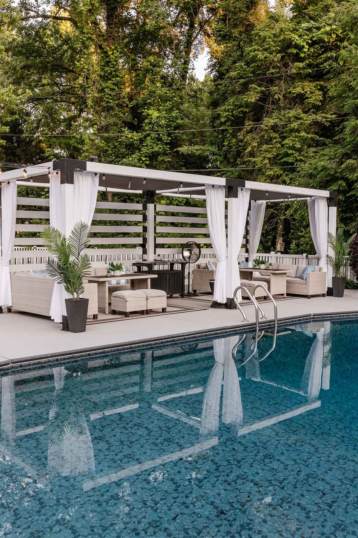 diy pool cabana beside a backyard pool