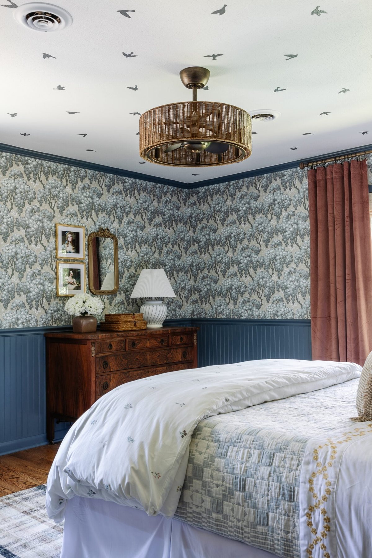 tween bedroom with blue floral wallpaper and rattan fandelier