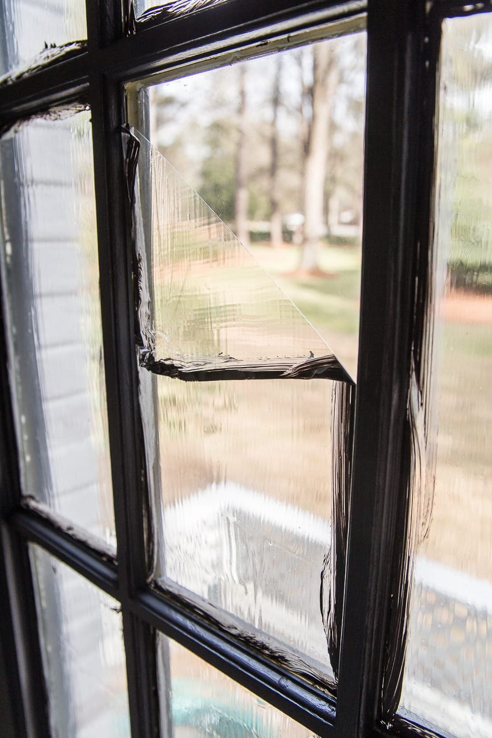 peeling masking liquid away from a french door window pane