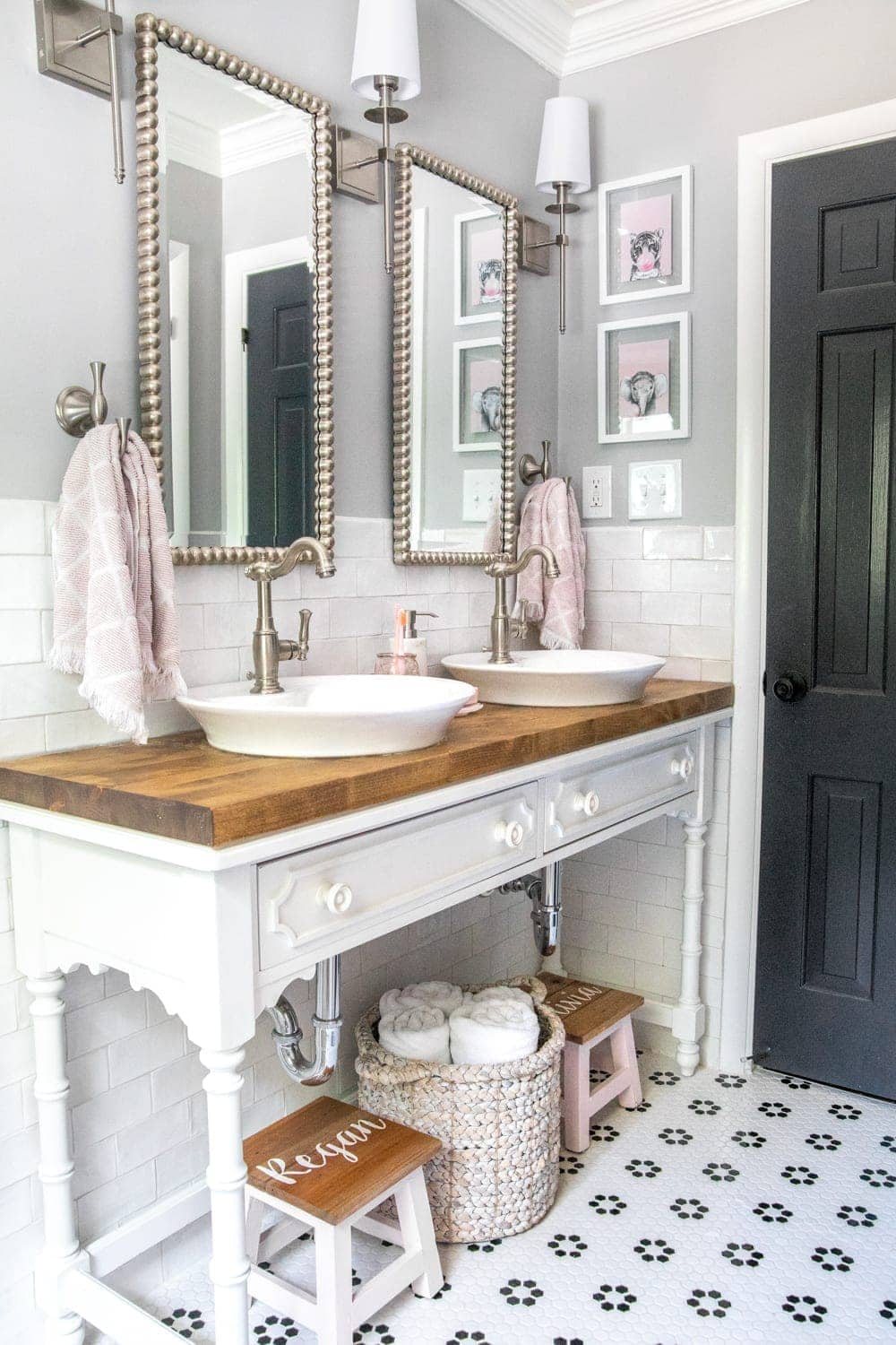 Whimsical, classic kids bathroom makeover | open vanity table with step stools and vessel sinks