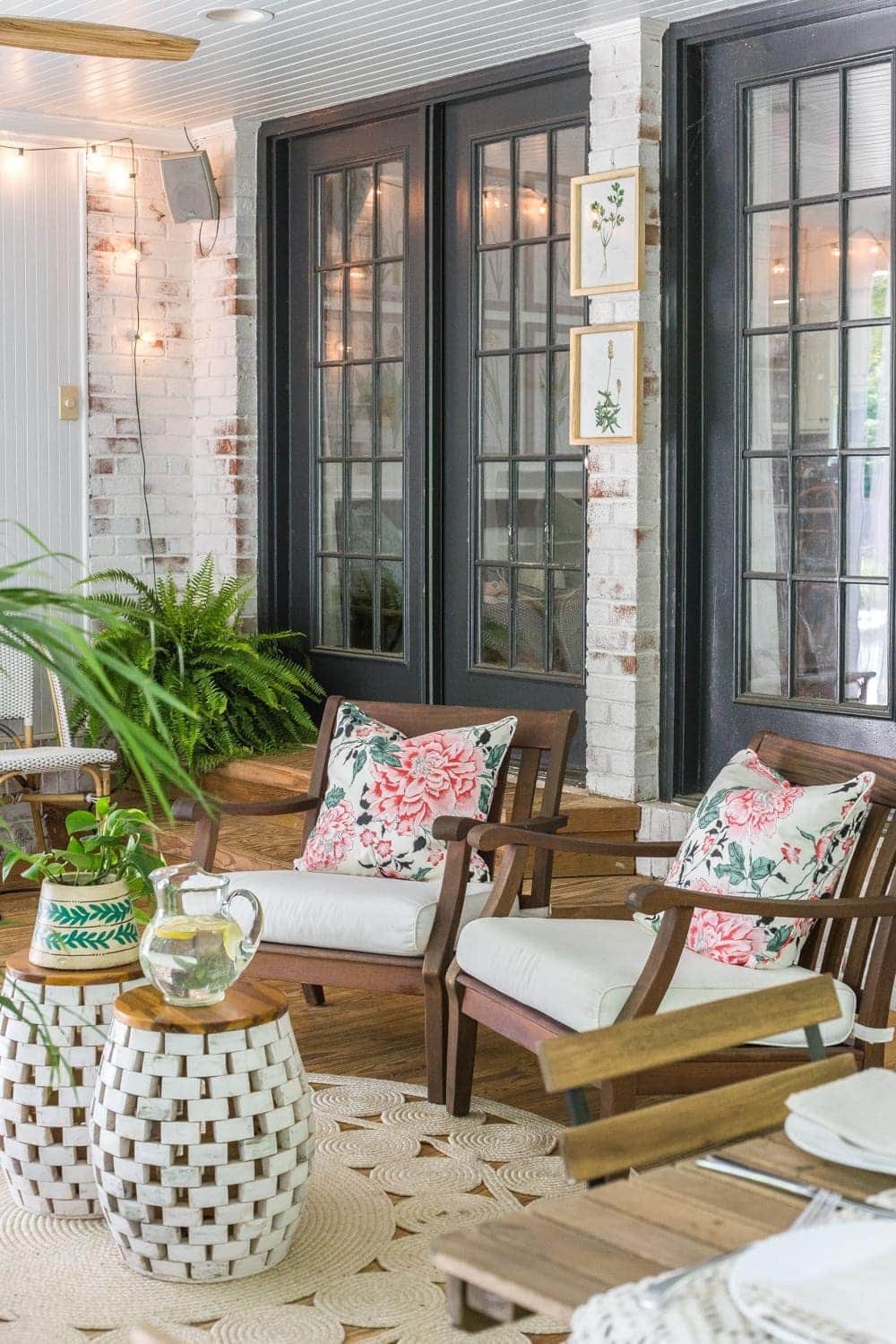 A tropical boho back porch decorated for summer with breezy, functional style from Walmart's Flower Home line by Drew Barrymore and string lights for evening ambience. #backporch #summerdecor
