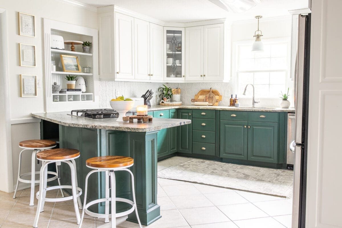 kitchen with green lower cabinets and white upper cabinets