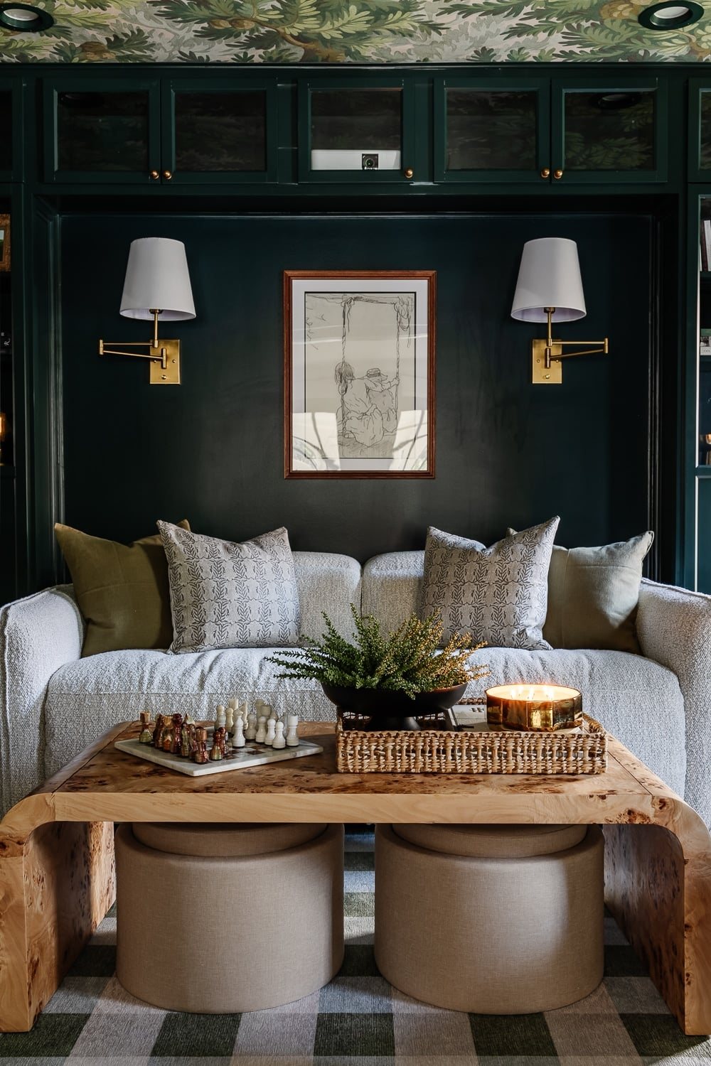 modern recliner sofa in media room surrounded by shelves with burl coffee table