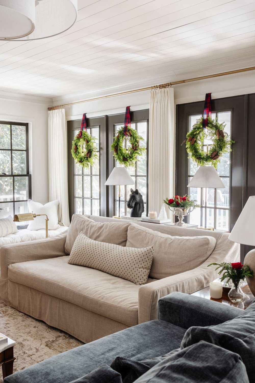 Ralph Lauren Christmas decorating ideas on a budget - wreaths with tartan plaid ribbon on windows