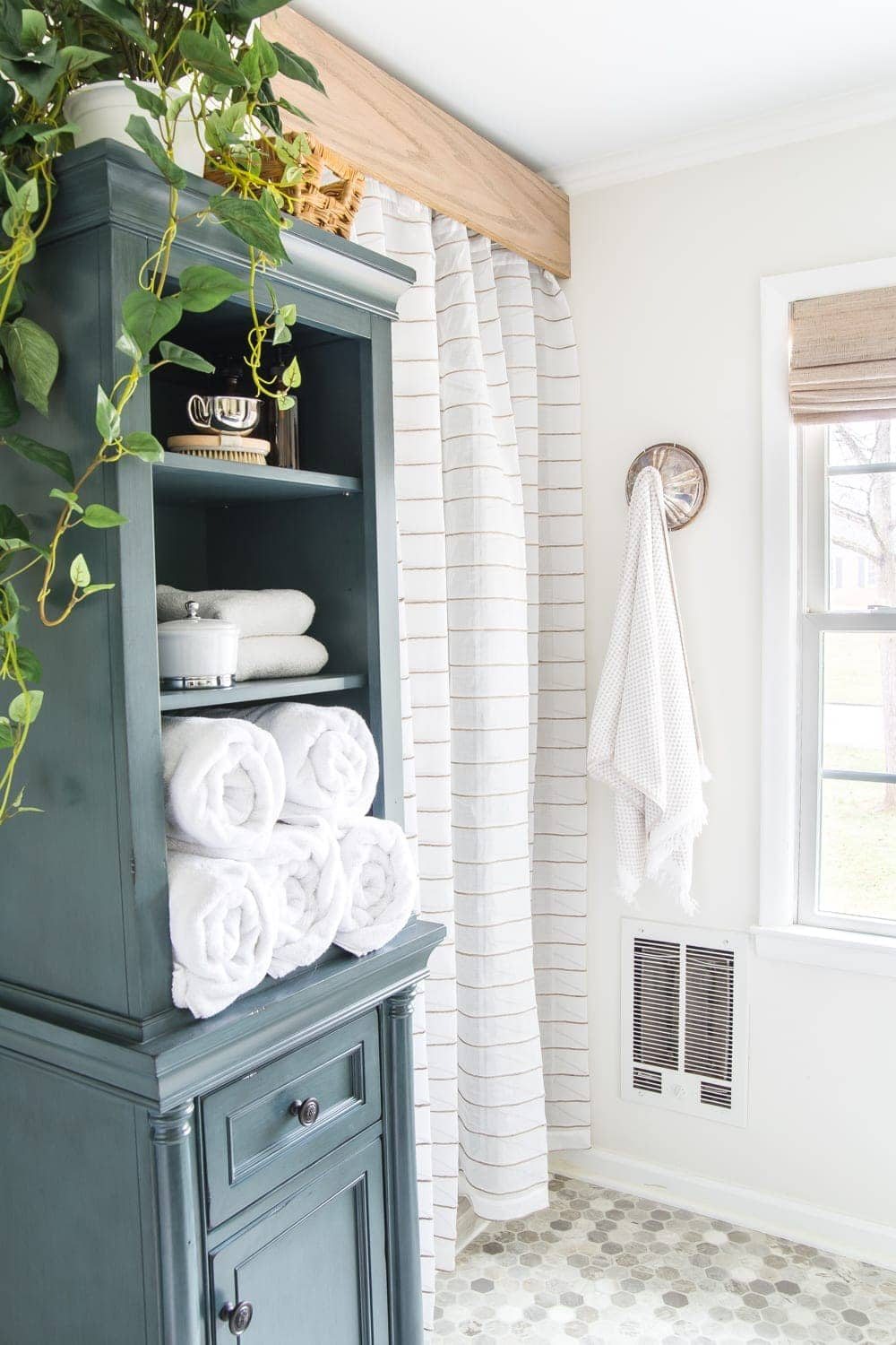 Budget Master Bathroom Refresh Reveal | old shower door cover-up with a semi-sheer curtain and a DIY wooden cornice