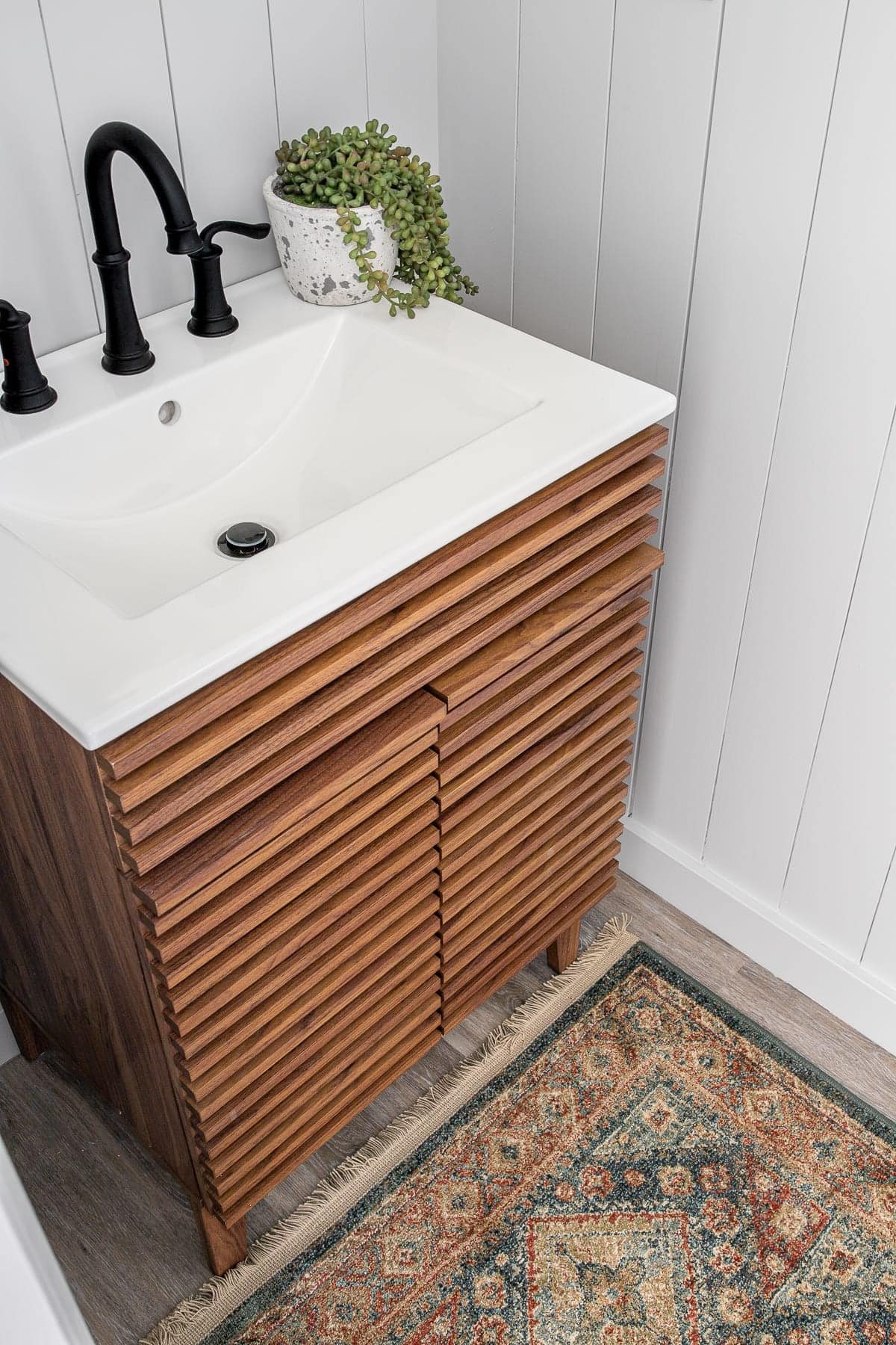 Mid Century Modern sink vanity and vintage style rug