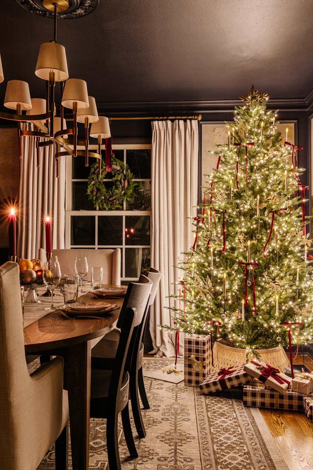 dining room Christmas tree at night in candlelight