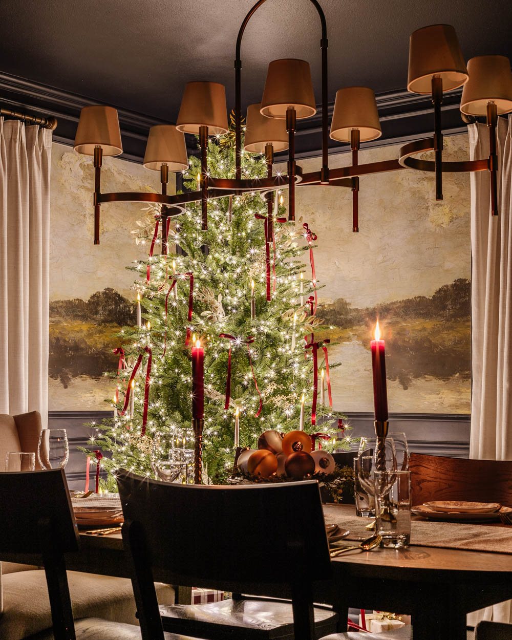 candlelight Christmas dining room table with centerpiece and tree