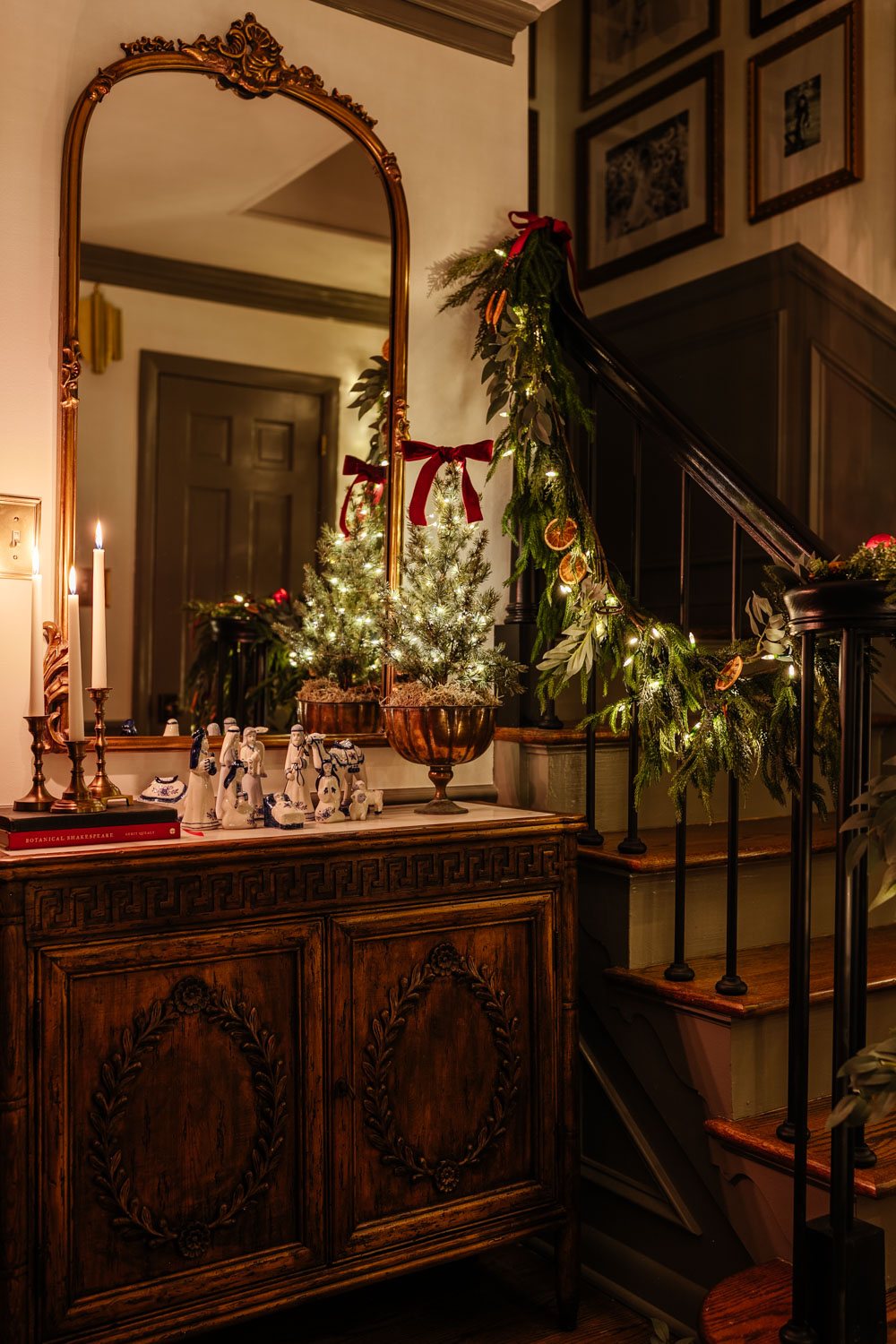 traditional candlelight Christmas night tour in entryway with nativity