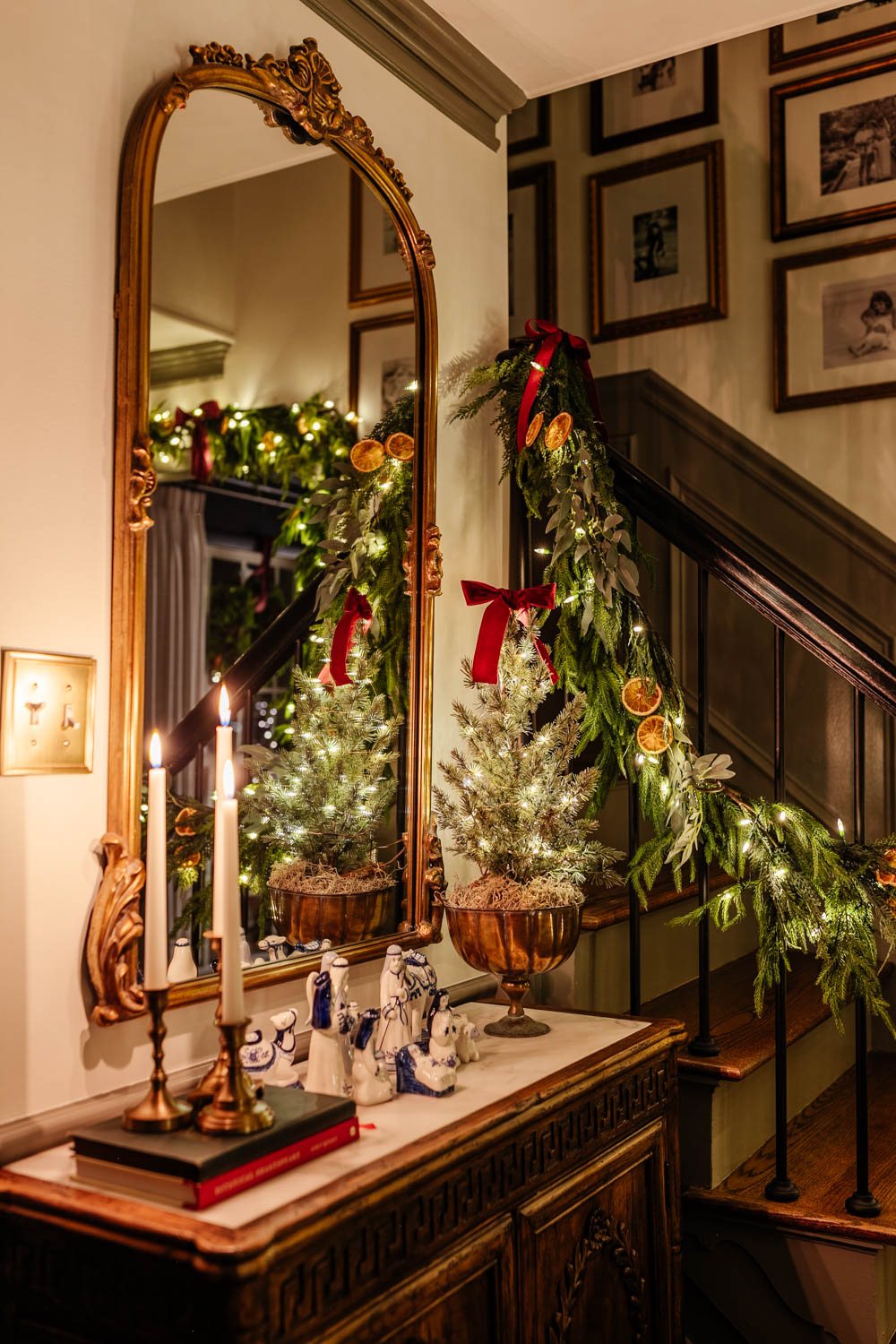 traditional candlelight Christmas night tour in entryway with nativity