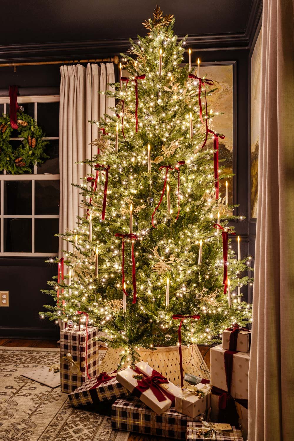 dining room Christmas tree at night in candlelight