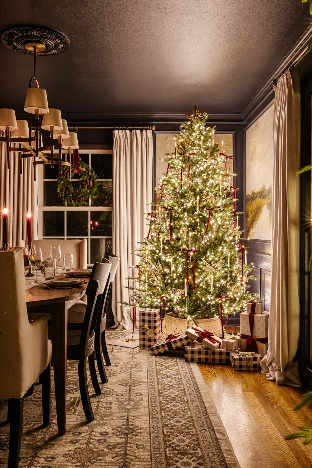dining room Christmas tree at night in candlelight