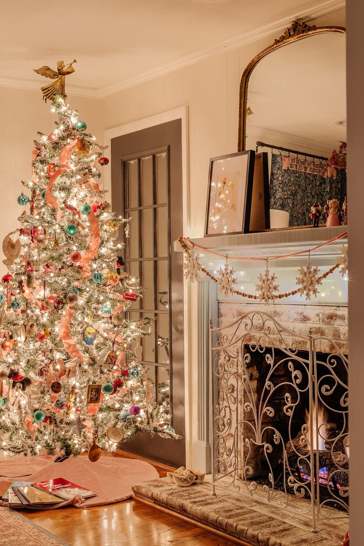 Christmas playroom with tree and mantel at night