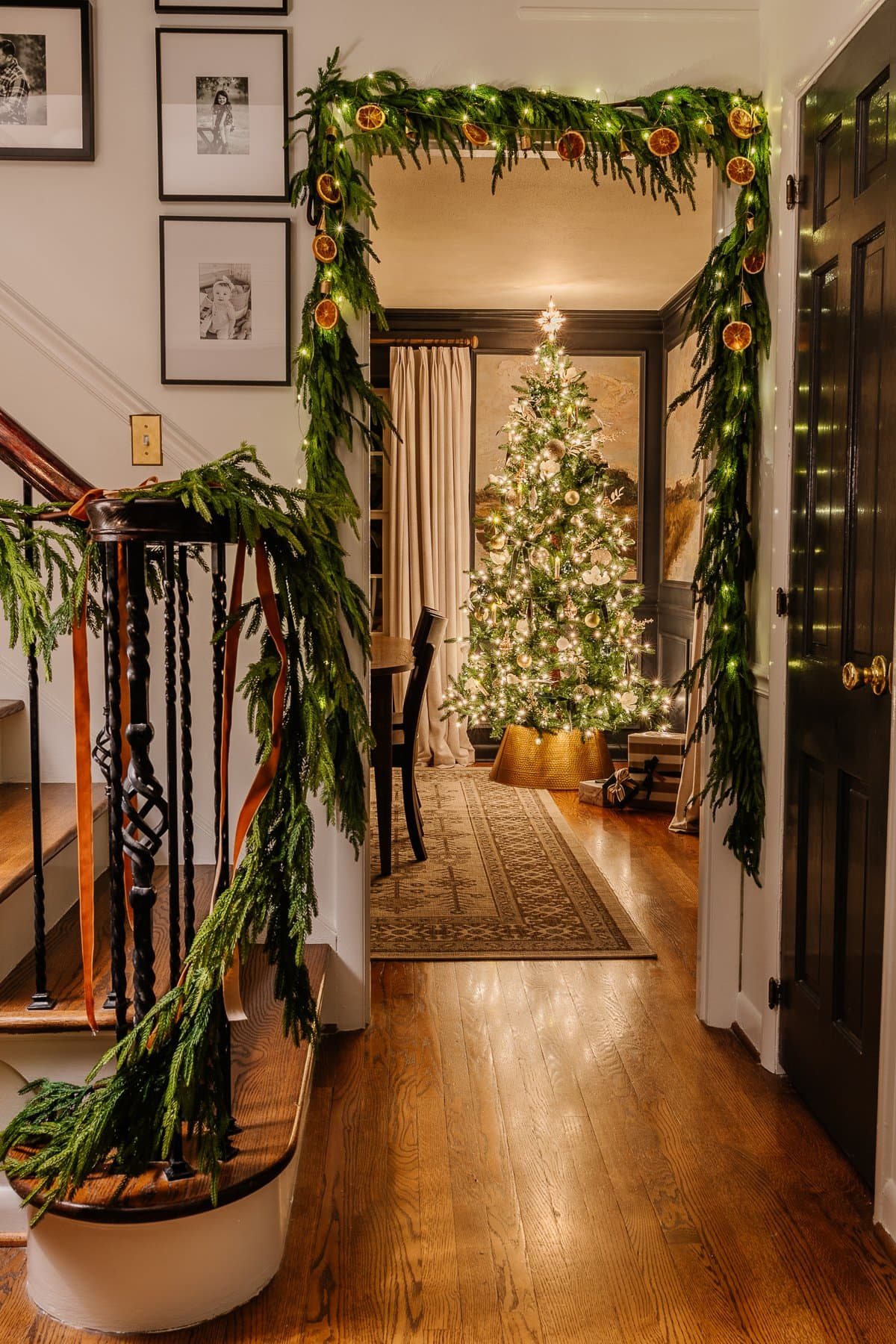 Christmas candlelight doorway from stairs leading into dining room