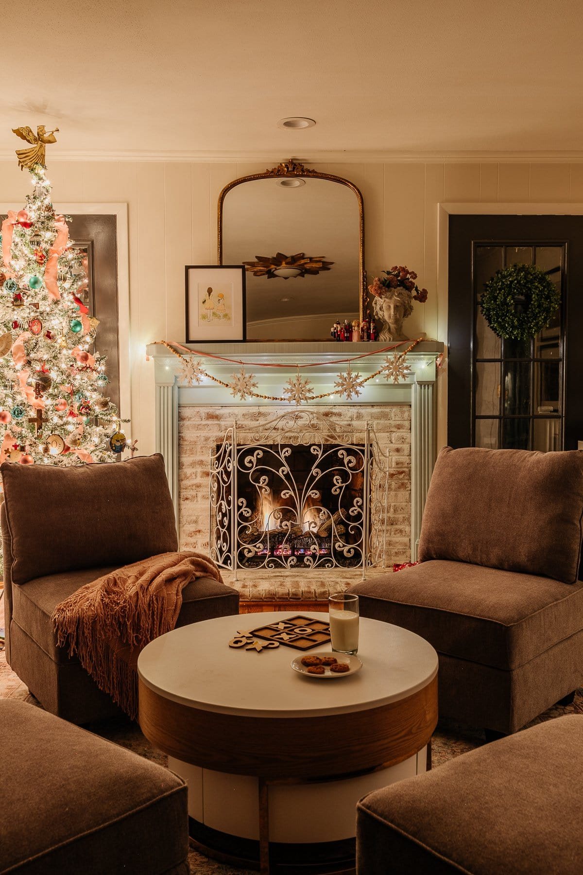 Christmas fireplace at Christmas tree in playroom at night