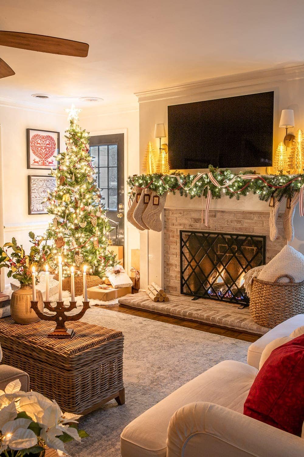 Christmas living room at night with fireplace and tree