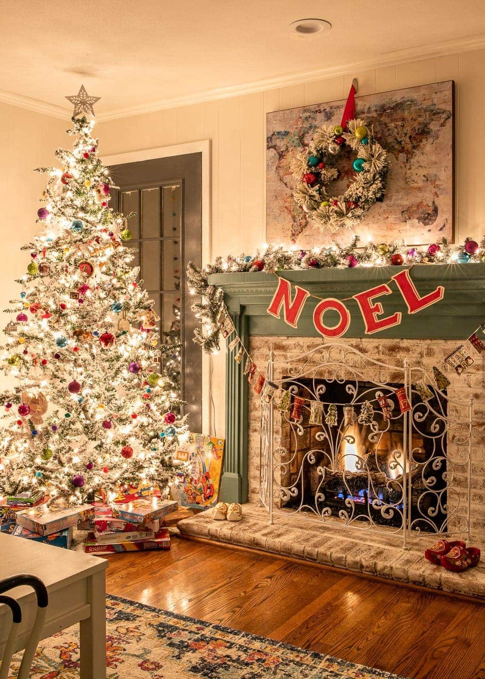 Christmas playroom at night with fireplace and tree
