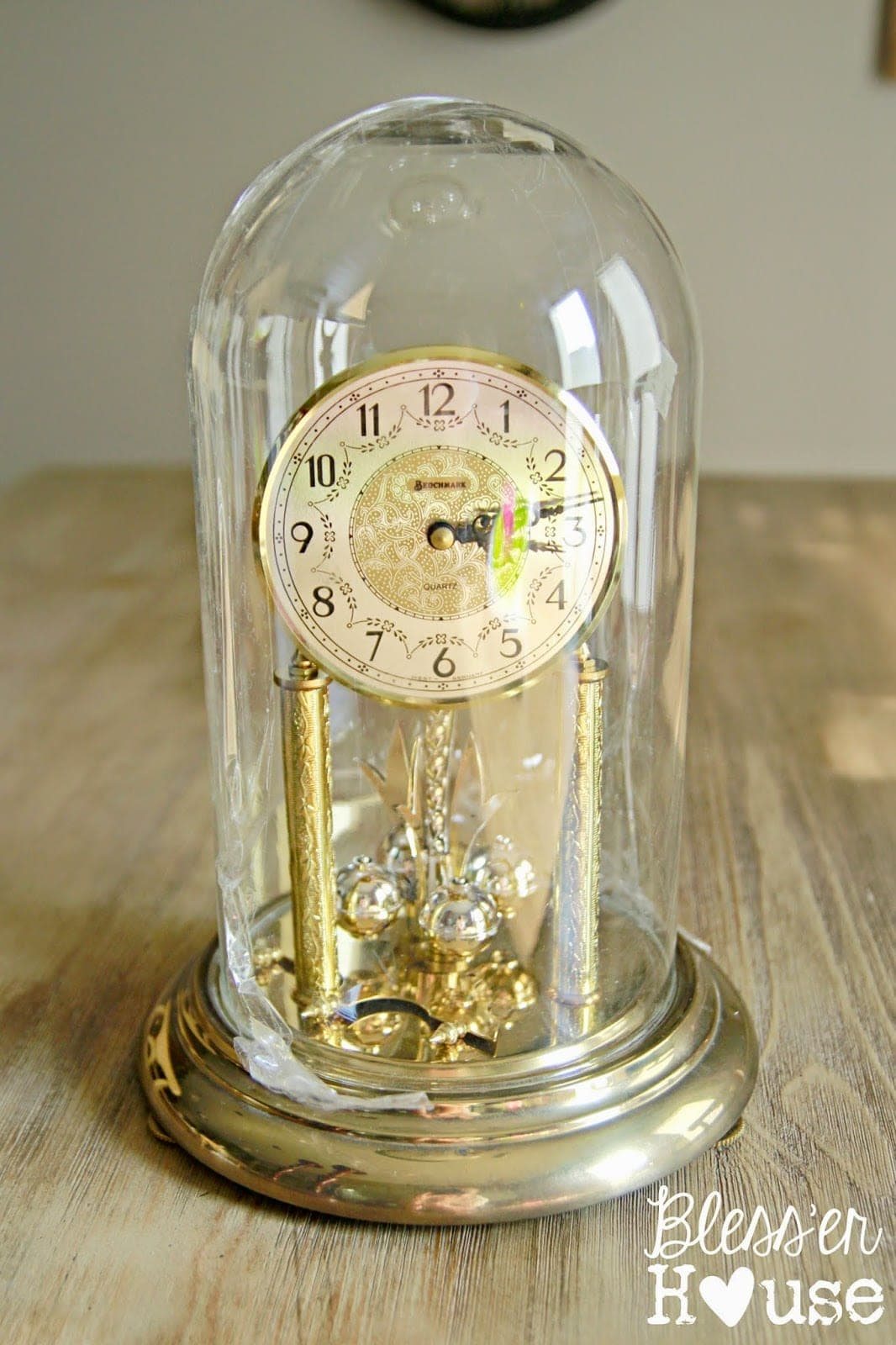 How to turn an old Christmas village figurine set and dome clocks into a snow globe inspired centerpiece. #Christmasdecor #ChristmasTable #ChristmasCenterpiece