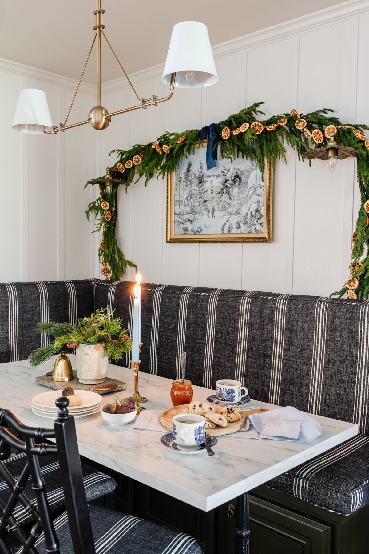 Holiday art printable of a winter snow scene on a breakfast nook wall