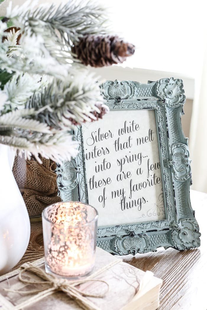 winter printable in a picture frame with saying "silver white winters that melt into spring... these are a few of my favorite things."