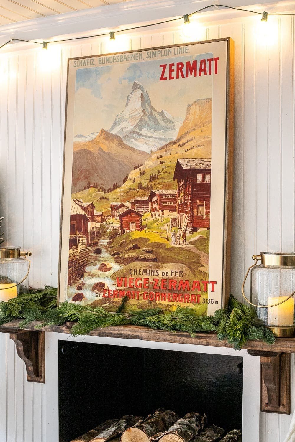 Christmas art made from covering old art on a canvas with a poster of a mountain scene