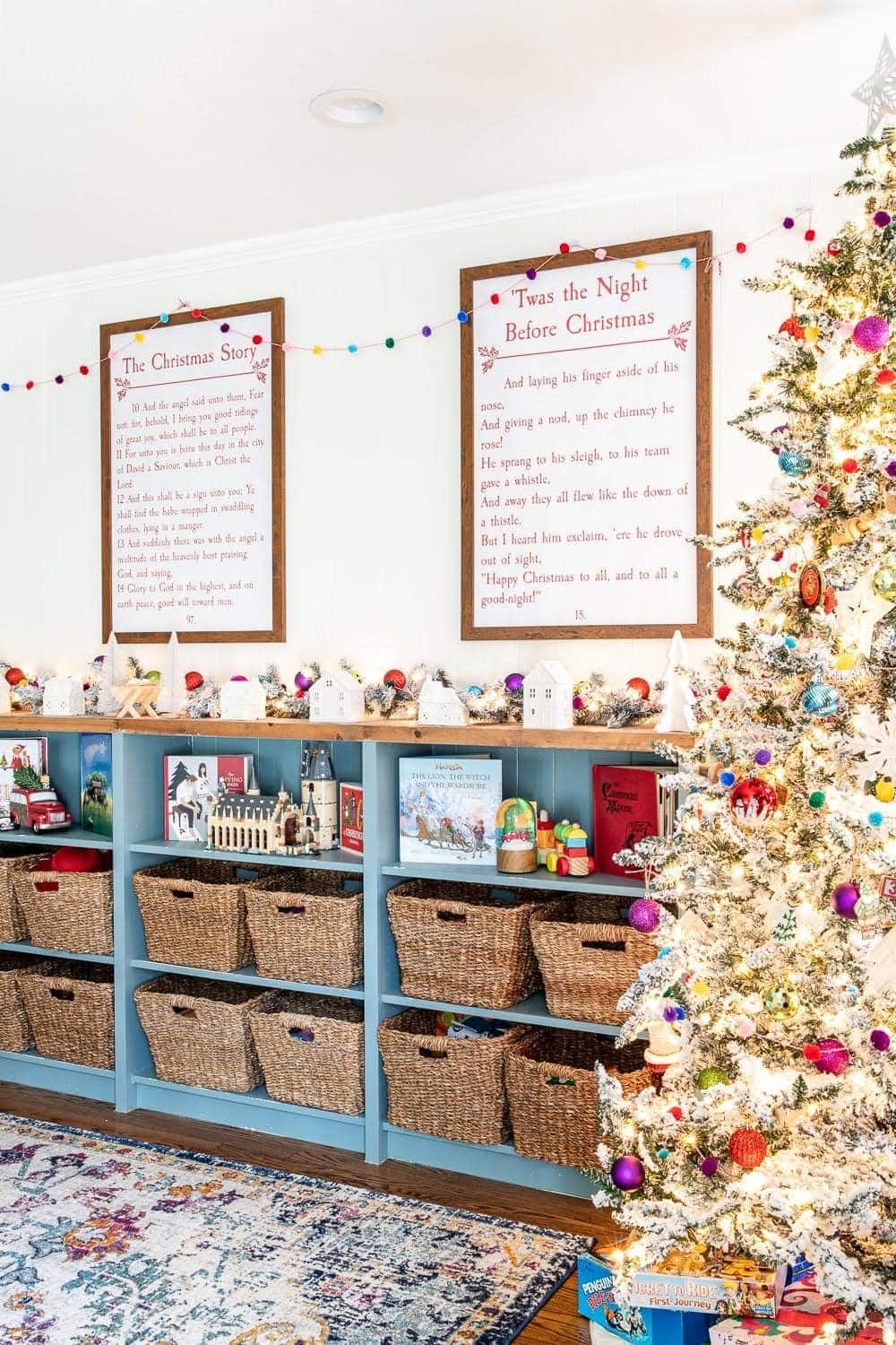 Storybook Christmas printable art hung on a wall in a playroom