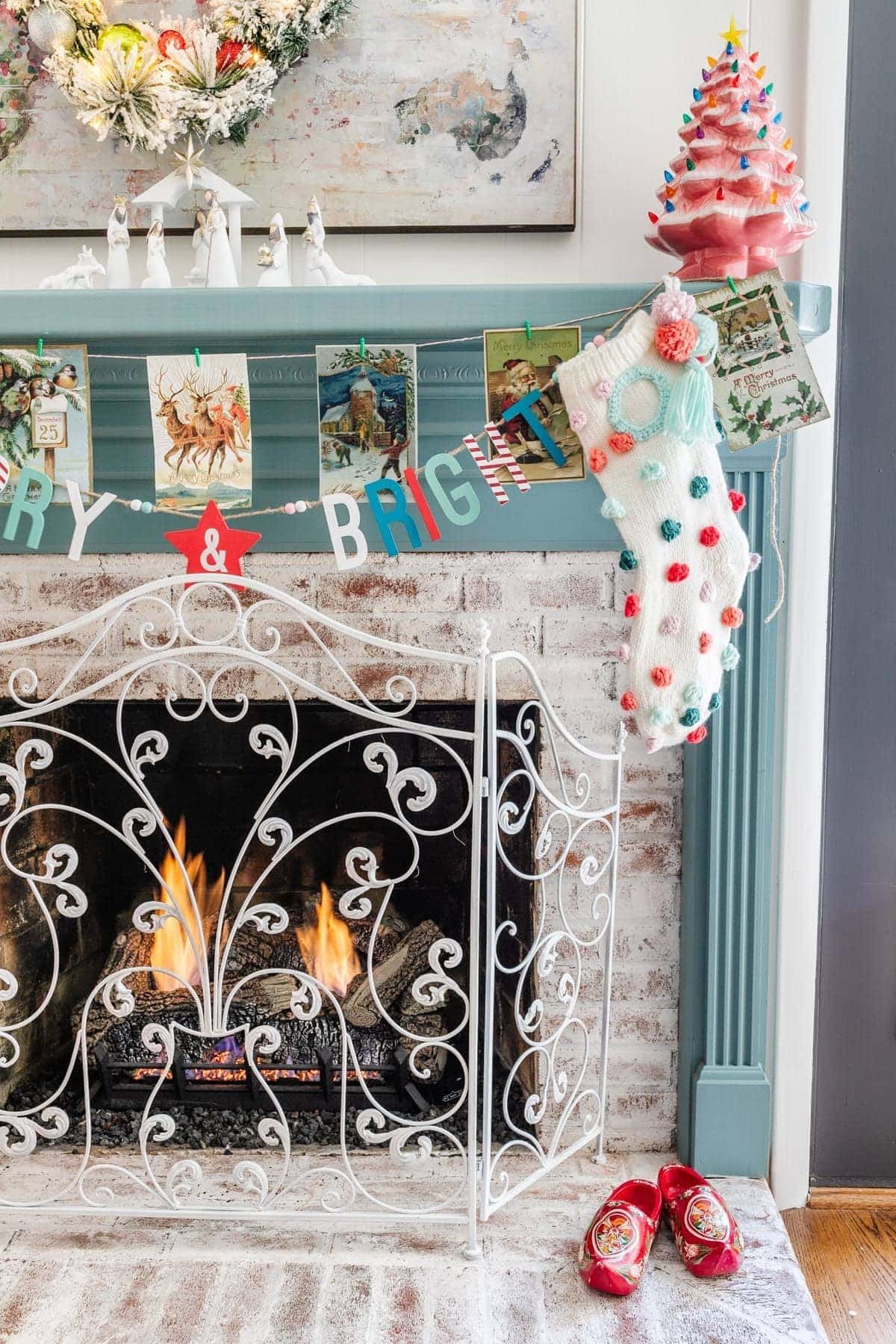 Christmas printable art of vintage Christmas cards made into garland on a mantel