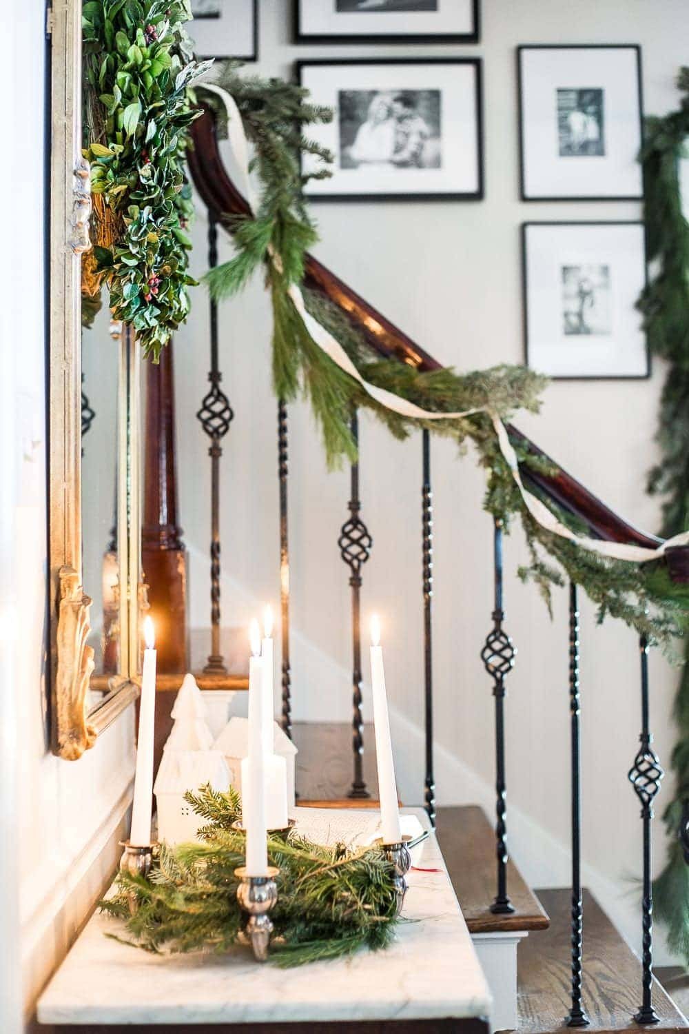 Classic Christmas Foyer | unigumushane.com - A classic traditional entryway / foyer decorated for Christmas using fresh pine and holly greenery and a St. Lucia Day Advent wreath. #christmasfoyer #classicdecor #traditionalchristmas