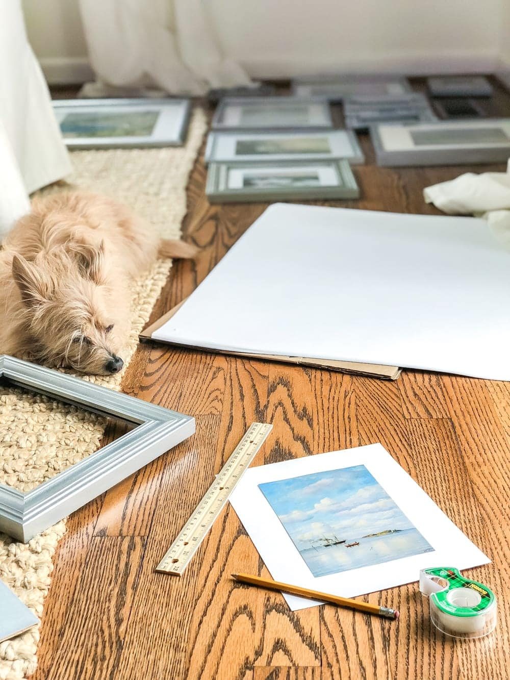 A free printable set of a coastal gallery wall featuring antique ocean paintings and how to frame them inexpensively with thrifted finds. #coastaldecor #gallerywall #bathroomart #bathroomwall #bathroomdecor #coastalart
