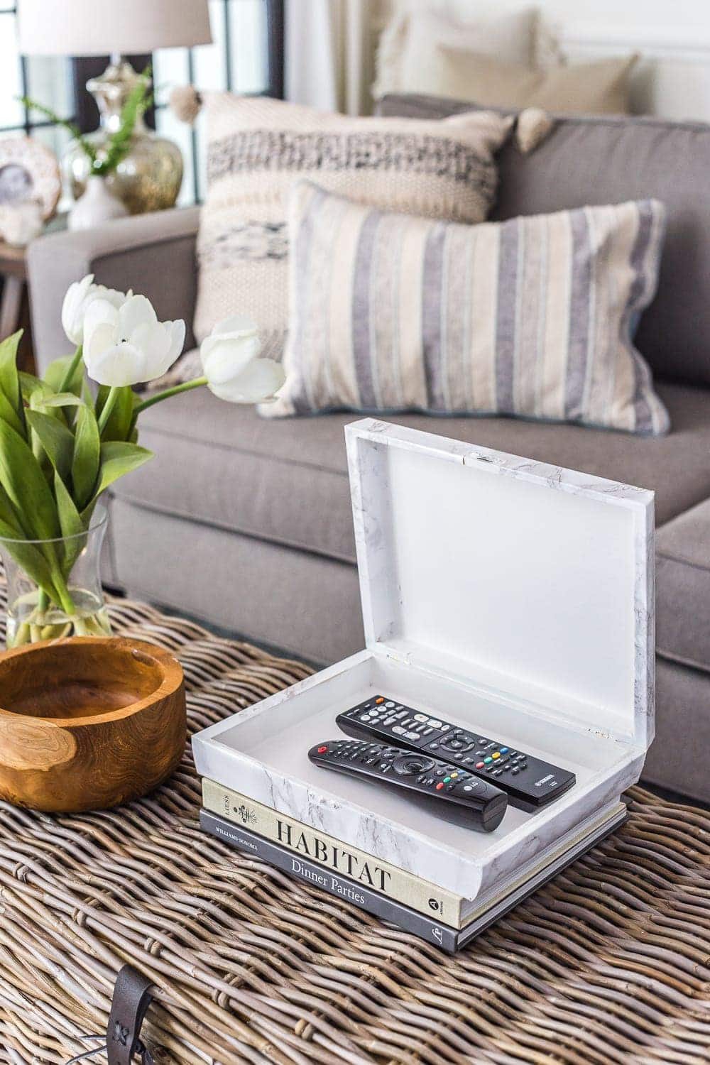 marble remote control holder on a coffee table for practical coffee table decor ideas