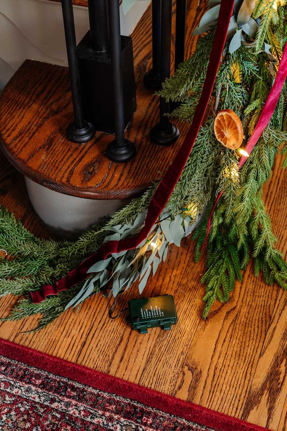 hiding battery pack of twinkle lights in garland
