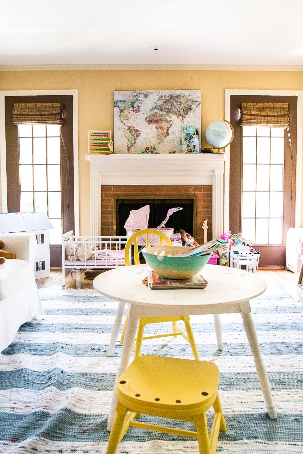 A dated, unorganized playroom gets a bright and whimsical makeover with organizational strategies, ideas for adding function, and DIY-able projects to create the perfect kid's space on a budget. #kidsroom #playroom #kidsdecor #toyorganizing