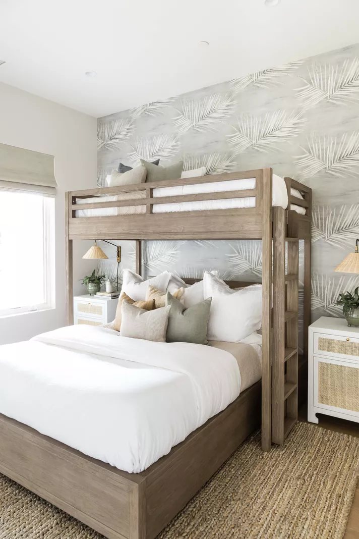 coastal style shared bedroom with twin over full bunk beds for 3 people