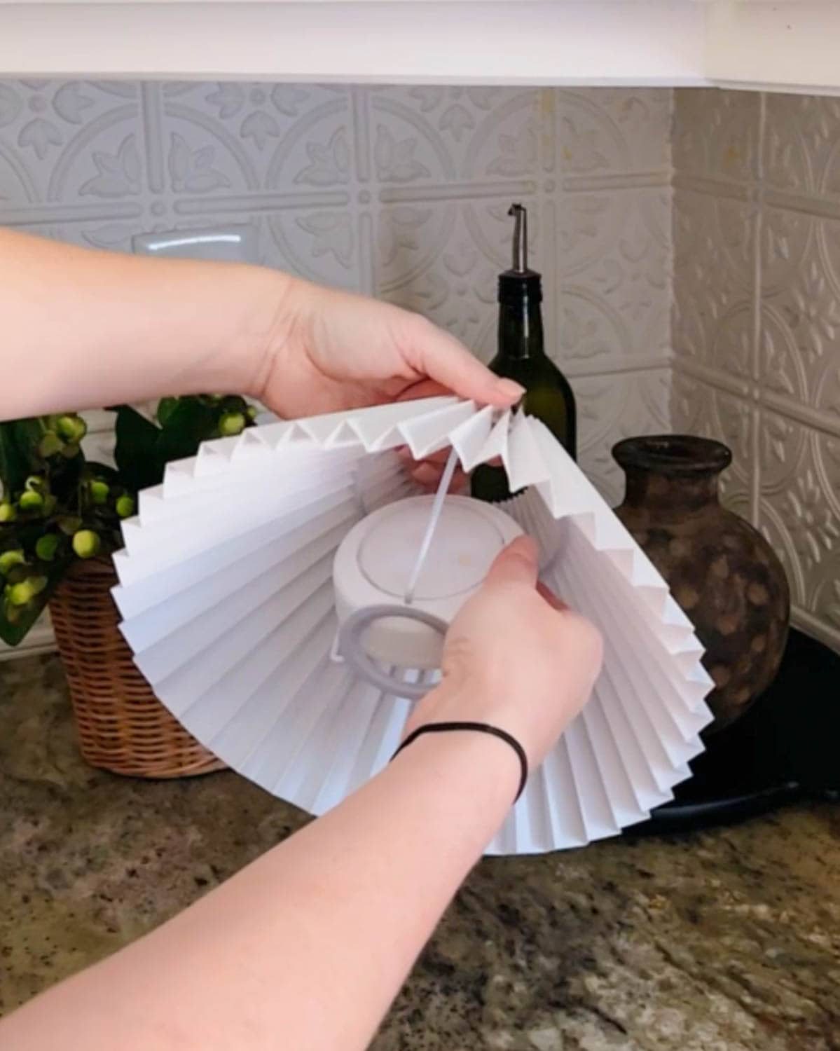 placing a battery light inside of a lamp shade