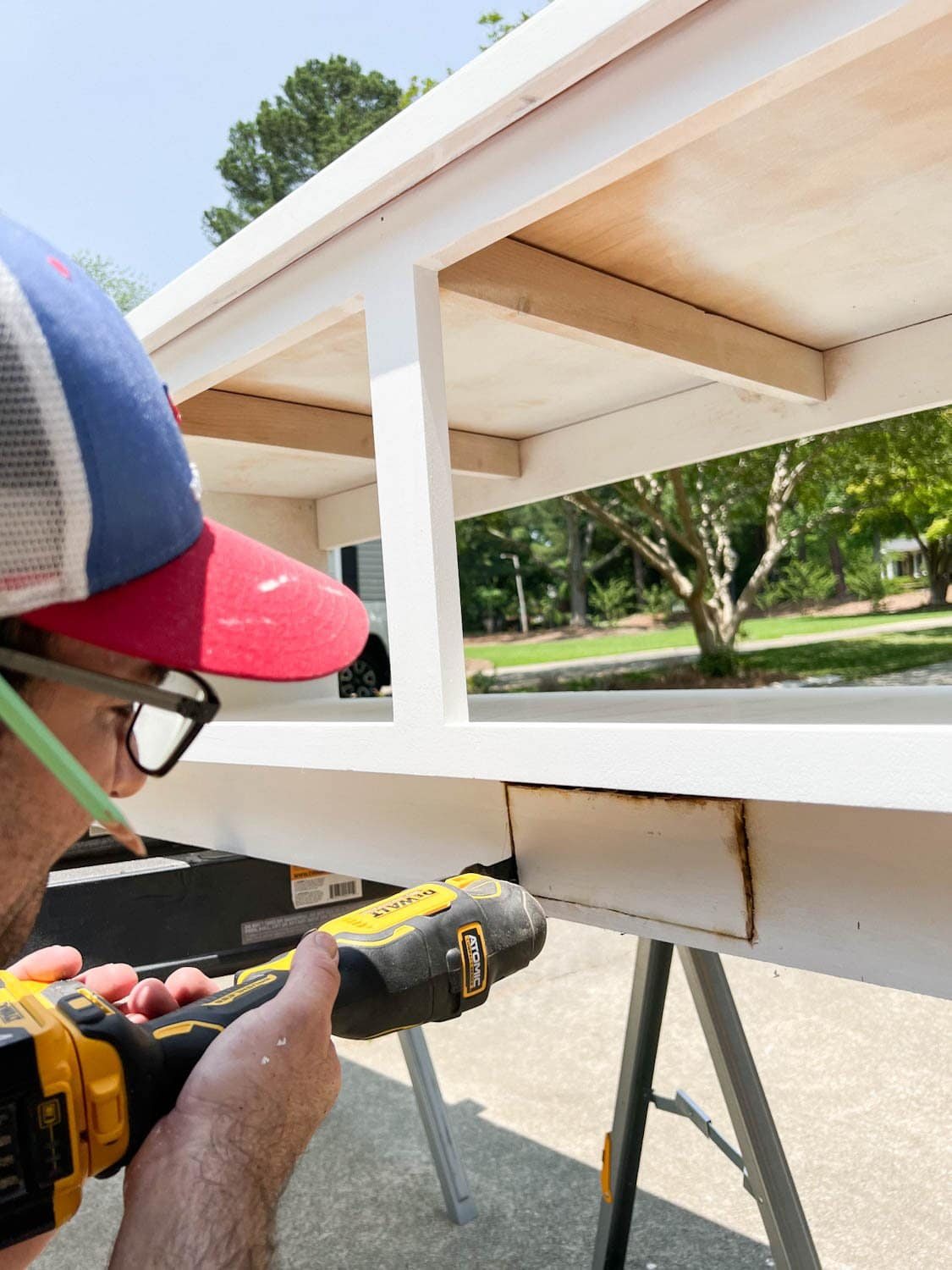 cutting a hole with an oscillating tool for an air vent redirect under a built in banquette