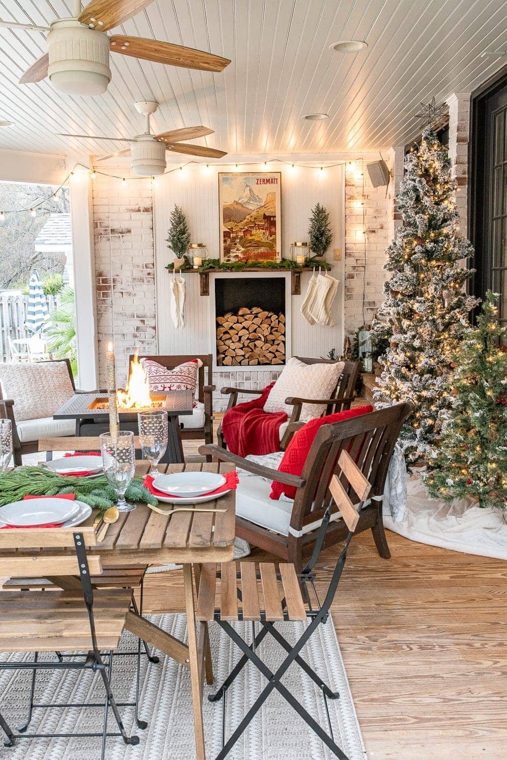 Cozy Christmas back porch with faux fireplace and fire pit
